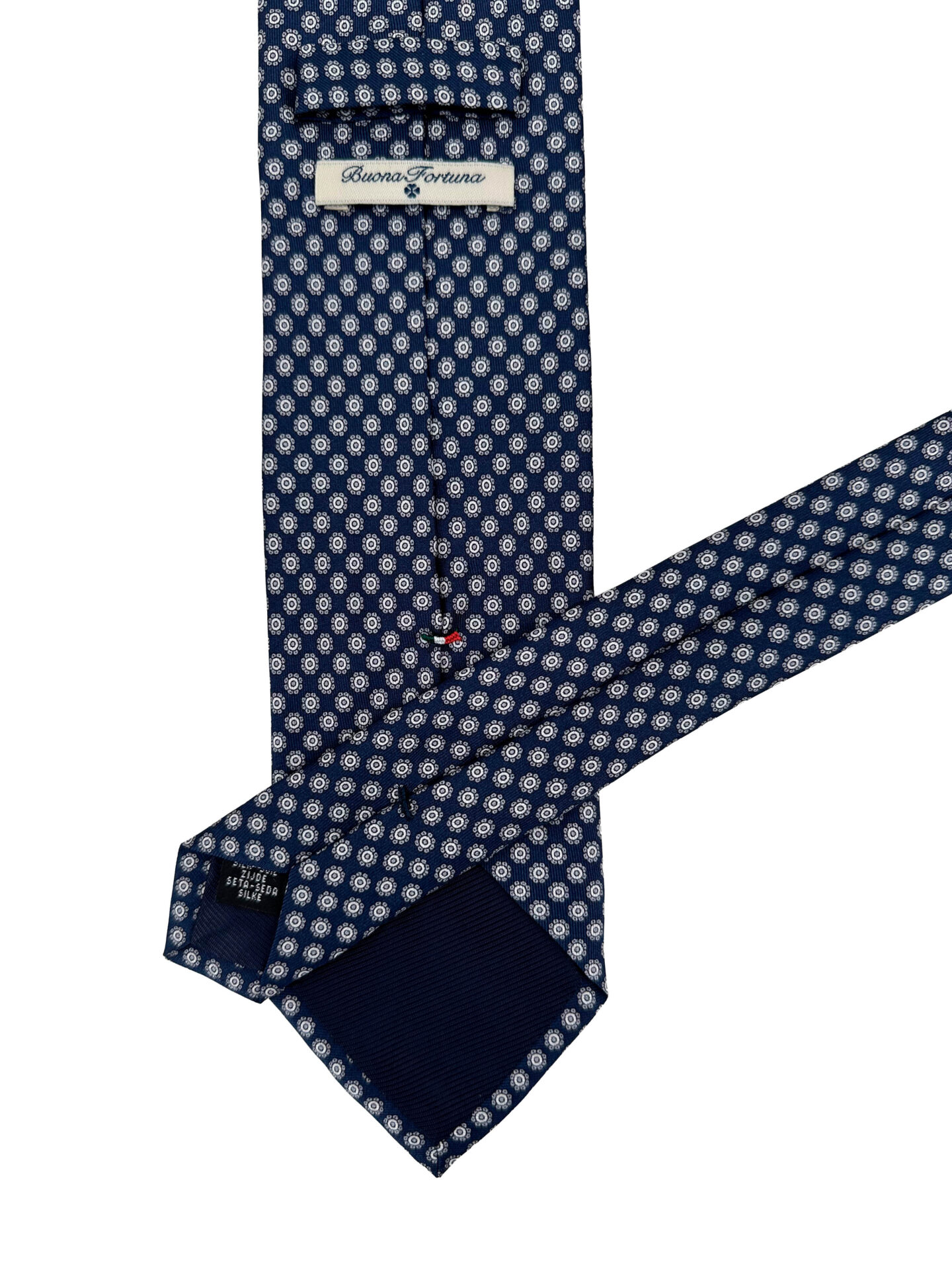 Corbata twill fondo azul marino estampada en motivos tipo flor en color banco y gris