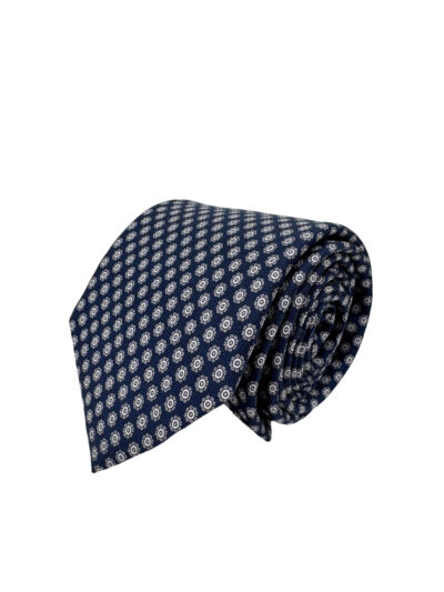 Corbata twill fondo azul marino estampada en motivos tipo flor en color banco y gris