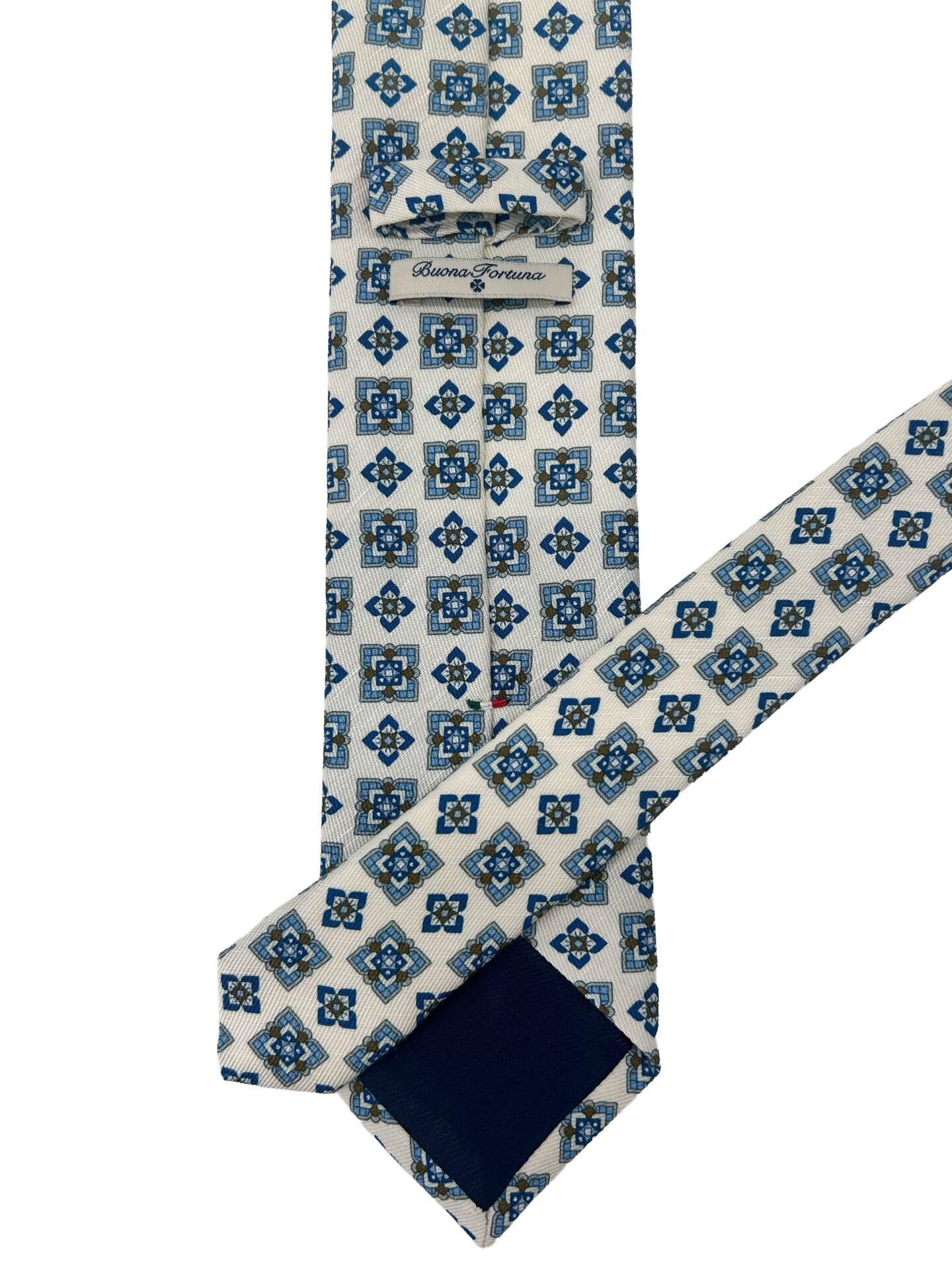 Corbata Twill Fondo Crudo y motivos azules y marrones.